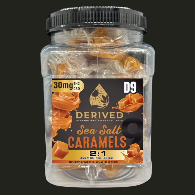Jar of sea salt caramels with a label indicating THC and CBD content, on a black background.